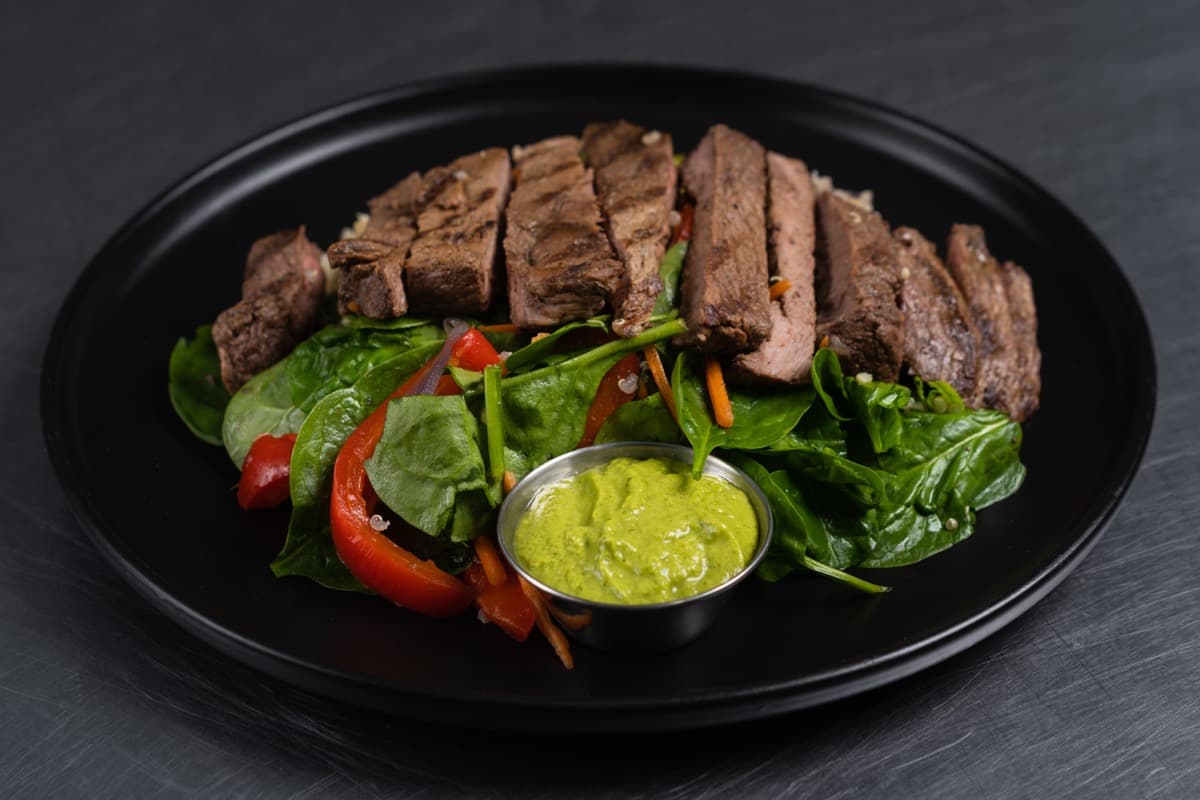 FoodieFit grilled steak with spinach salad and chimichurri